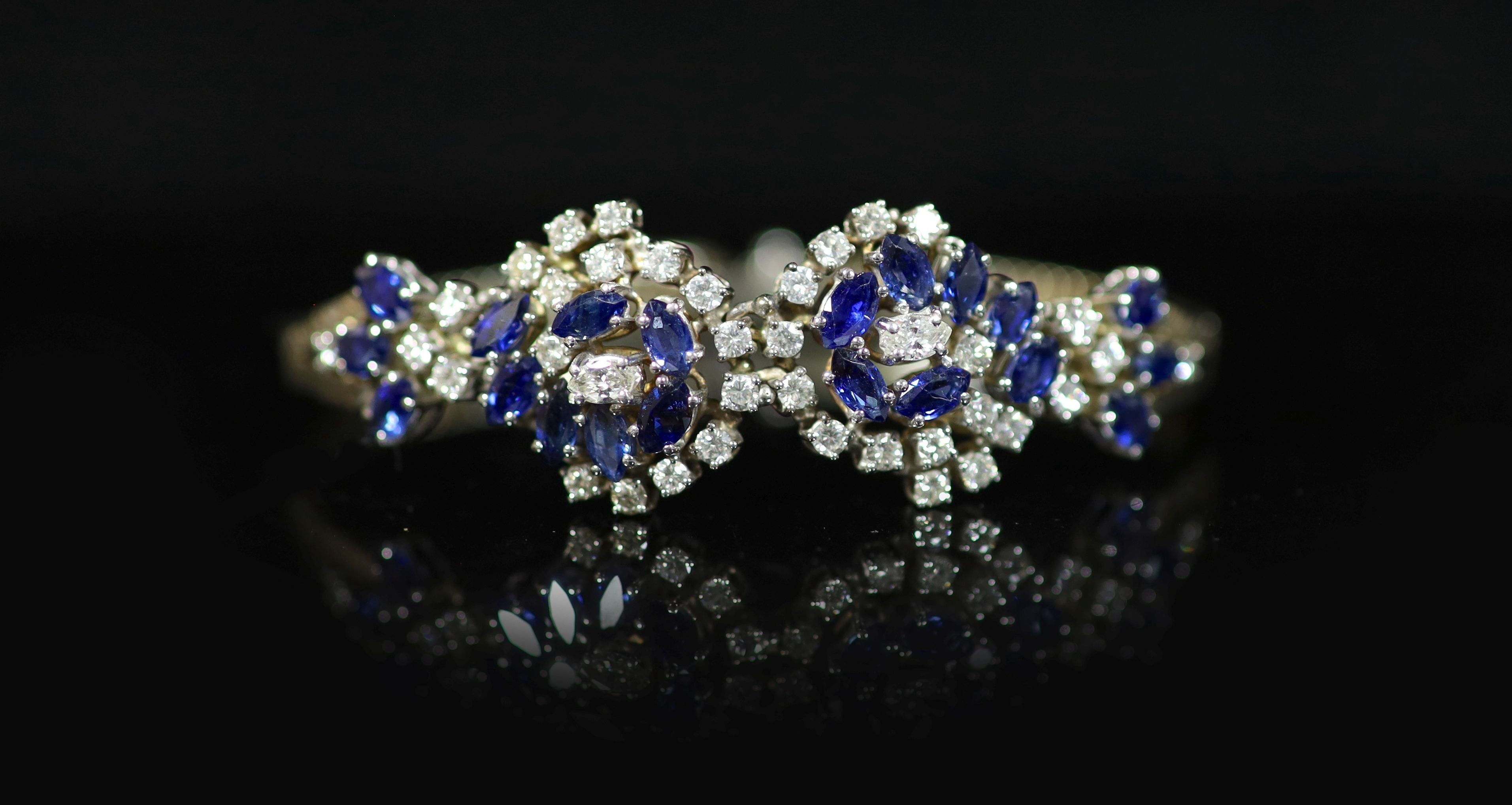 A 18ct white gold sapphire and diamond set double cluster bracelet
